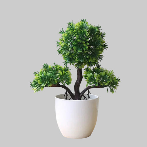 Artificial bonsai plant in pot made of plastic for home and office desk decoration